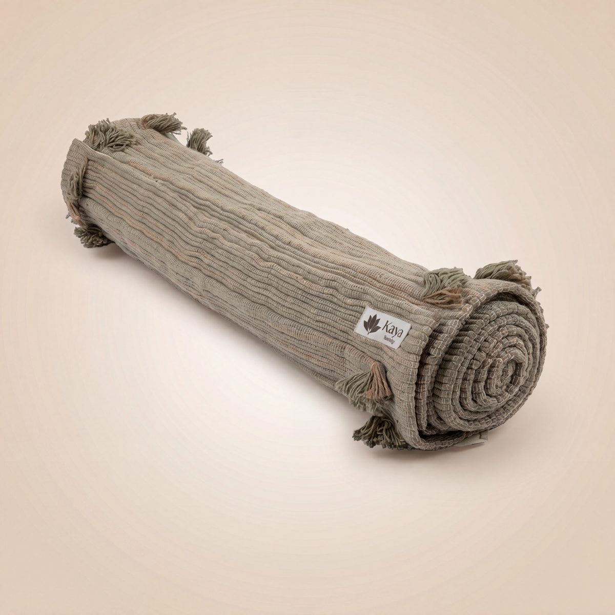 Anaha Green handloomed cotton yoga rug rolled and tied
